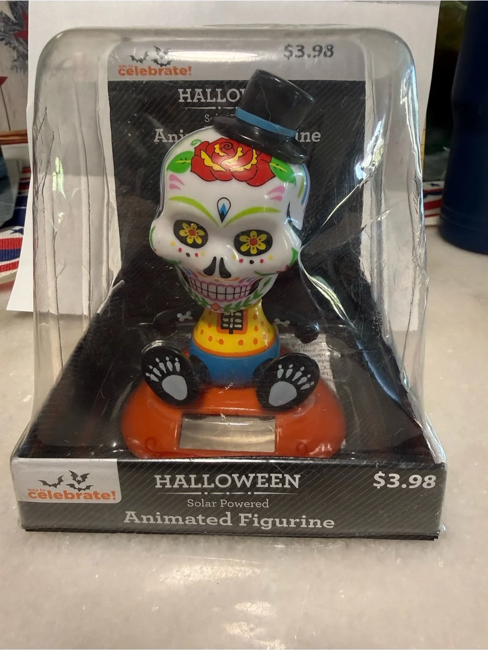 Day of the Dead Skull Solar-Powered Animated Figurine - White & Orange